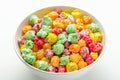 Colorful sweet popcorn from a shop in white bowl. Delicious treat.