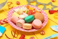 Colorful sweets. Lollipops, macaroons, marshmallow, marmalade, chocolate and candies. Top view with space for your greetings Royalty Free Stock Photo