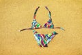 Colorful swimsuit on the golden sandy beach Royalty Free Stock Photo