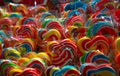 Colorful swirl lollipops at confectionery. Sweet candy for kids party. Candy day concept. Spiral rainbow color lollipops.