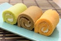 Colorful swiss roll on green dish Royalty Free Stock Photo