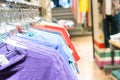 Colorful t-shirts aligned in a dress shop Royalty Free Stock Photo