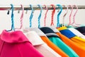 Colorful T-shirts on hangers Royalty Free Stock Photo