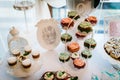 Colorful table with sweets and goodies for the wedding party reception, decorated dessert table. Delicious sweets on candy buffet Royalty Free Stock Photo