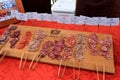 Wood tray with samples of salami, served during Food festival, The Lumberyard, Laguna Beach, California, 2016