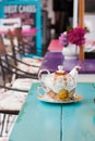 Colorful tables with nested tea set Royalty Free Stock Photo