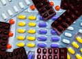 Colorful tablet pills in blister packs. Global healthcare concept. Pain killers medicine use for relieve pain.