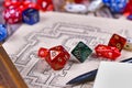 Colorful tabletop role playing RPG game dices on hand drawn dungeon map Royalty Free Stock Photo
