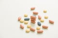 Colorful tablets with capsules. stack of pill and capsule with shadow on shading background Royalty Free Stock Photo