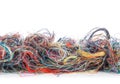 Colorful tangled threads isolated on white. Closeup