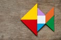 Colorful tangram puzzle in fish shape