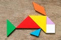 Colorful tangram puzzle in swimming fish or carp shape