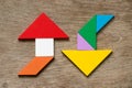 Colorful tangram puzzle in upward and downward arrow shape