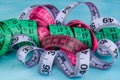 Colorful tapemeasure on blue background Royalty Free Stock Photo