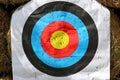 Practice target face with lot of shots. Used archery target on position at archery range summertime open air outdoors Royalty Free Stock Photo