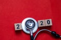 Colorful on text 2020 to 2021 banner for health care and Red heart love medical concept. black stethoscope,on table red background