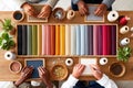 Colorful textile crafting session with diverse participants and materials on a table Royalty Free Stock Photo