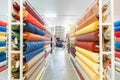 Colorful textile fabric material rolls in warehouse Royalty Free Stock Photo