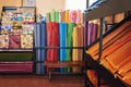 Colorful textiles on racks and shelves in a fabric shop