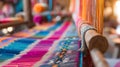 Colorful textiles on traditional loom. Artisan fabrics production Royalty Free Stock Photo