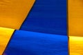 Colorful texture of old circus tent forming blue and yellow geometric figures Royalty Free Stock Photo