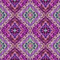 Colorful textured purple, pink and green diamonds in a seamless repeating pattern