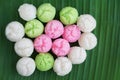 Colorful Thai dessert on a green banana leaf . Steamed cup cake muffin Royalty Free Stock Photo