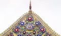 Colorful Thai Ornament Temple Decoration Pattern Roof gable Golden Thai style temple. Old floral, ceramic tile patterns of gable Royalty Free Stock Photo