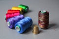 Colorful thread skeins and a thimble