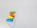 Colorful thread spools and needle on a plain background Royalty Free Stock Photo
