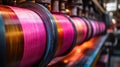 Colorful thread spools winding on industrial machinery Royalty Free Stock Photo