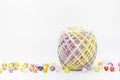 Colorful threads ball for knitting and beads on a white. Royalty Free Stock Photo