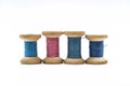 Colorful threads for sewing. Different threads on wooden vintage reels Royalty Free Stock Photo