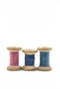 Colorful threads for sewing. Different threads on wooden vintage reels Royalty Free Stock Photo