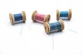 Colorful threads for sewing. Different threads on wooden vintage reels Royalty Free Stock Photo