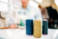 Colorful threads on spools closeup, dressmaking