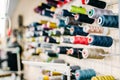 Colorful threads on spools closeup, sewing