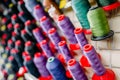 Colorful threads on spools closeup, sewing