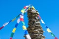 Colorful Tibetan Buddhist prayer flags hanging on a stone pile o Royalty Free Stock Photo