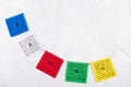 Colorful Tibetan buddhist prayer flags by Nepal on a grey background, copy space Royalty Free Stock Photo