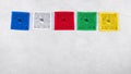 Colorful Tibetan buddhist prayer flags by Nepal on a grey background, copy space Royalty Free Stock Photo