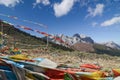 Colorful tibetan flags with blue sky at view point along the road to Yading nature reserve