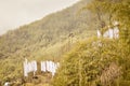 Colorful Tibetan flags decoration Buddhist prayer flags at the foothill of high Himalaya mountains and blue sky in Ladakh region Royalty Free Stock Photo