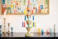 colorful, tiered candlestick holder with multiple lit candles