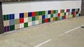 Colorful tile of sidewall along a road