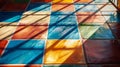 Colorful tiled floor with sunlight and shadow patterns, abstract geometric design Royalty Free Stock Photo
