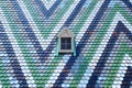 Colorful Tiles and One Small Window of the Saint Stephansdom Cathedral in Vienna Austria