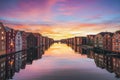 Colorful timber houses surrounding river Nidelva in the city of Trondheim at sunset.Norway