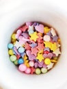 Colorful tiny sprinkles shapes in cup