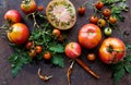 Colorful tomatoes red tomatoes yellow tomatoes orange tomatoes with water drops on the dark concrete background. Space for text se Royalty Free Stock Photo